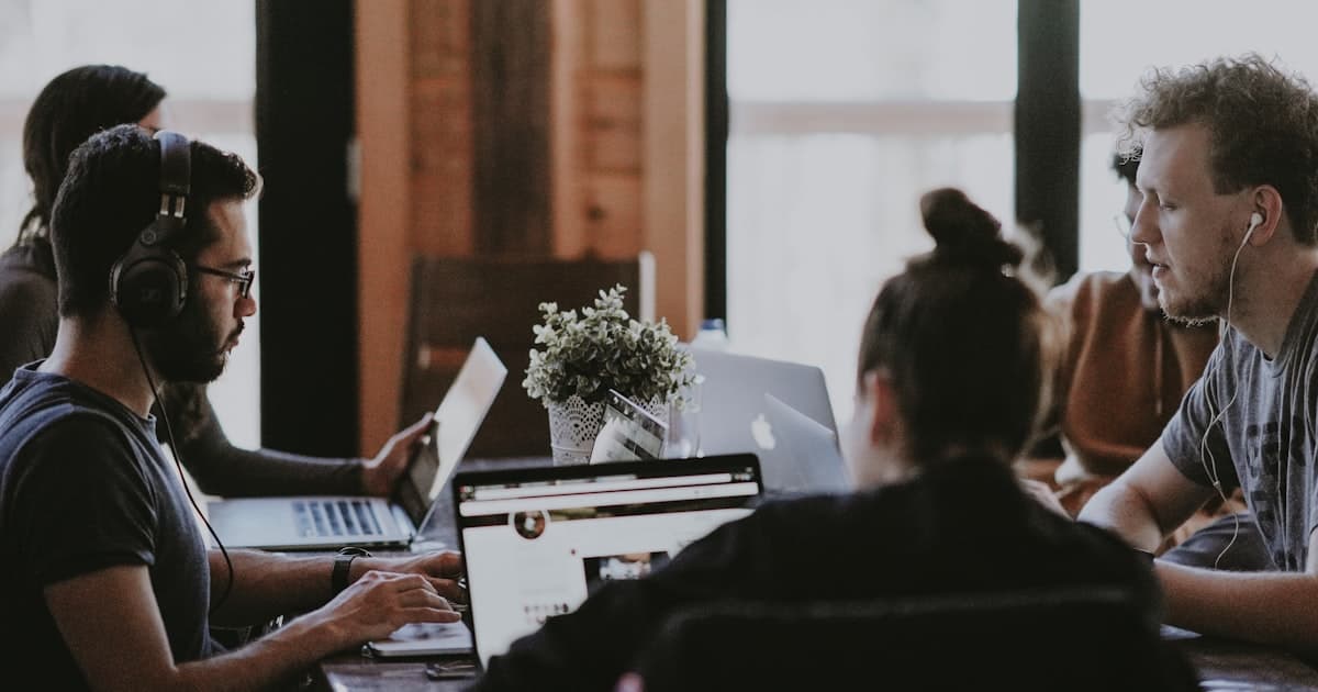 Small business team working together — AI automation helps SMBs scale without adding headcount